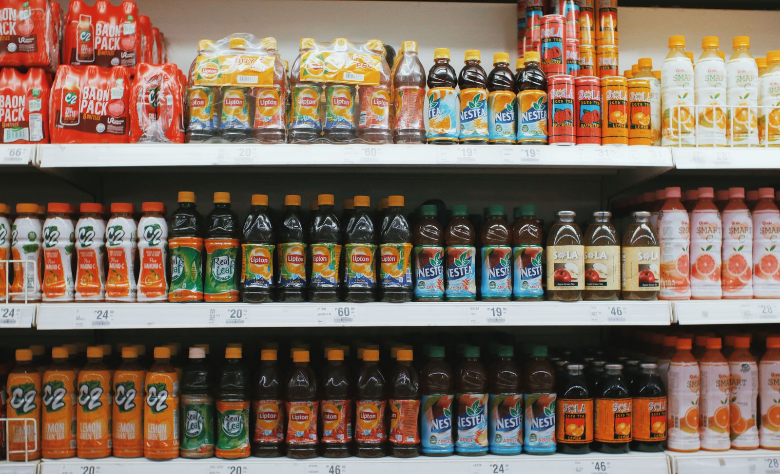 Dense shelf of beverage bottles with each unit detected and counted by computer vision.