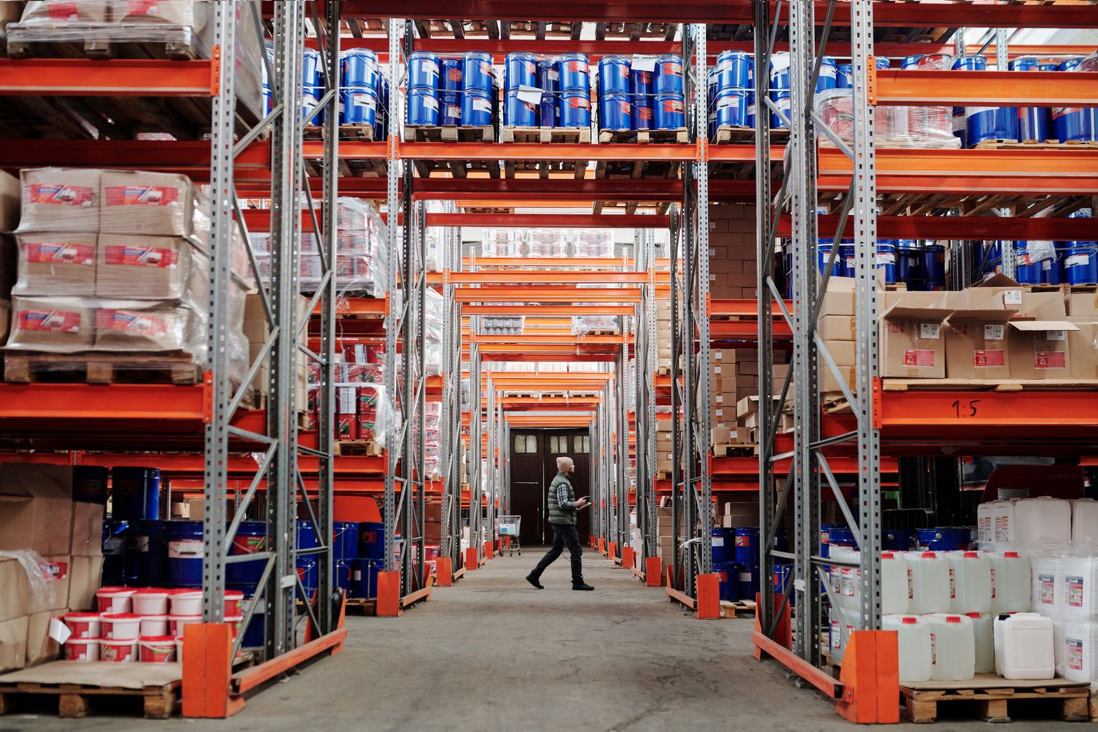 Warehouse racks of drums, pallets and cartons counted in real time by computer vision.